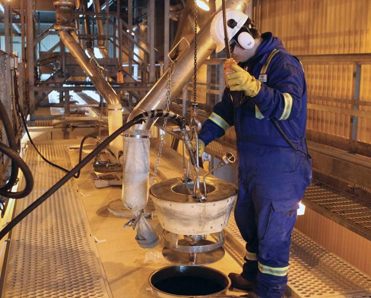 Photo of worker loading a railcar