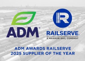 Logos of ADM and Railserve with the text: "ADM Awards Railserve 2025 Supplier of the Year" over a background of railcars in a rail yard.